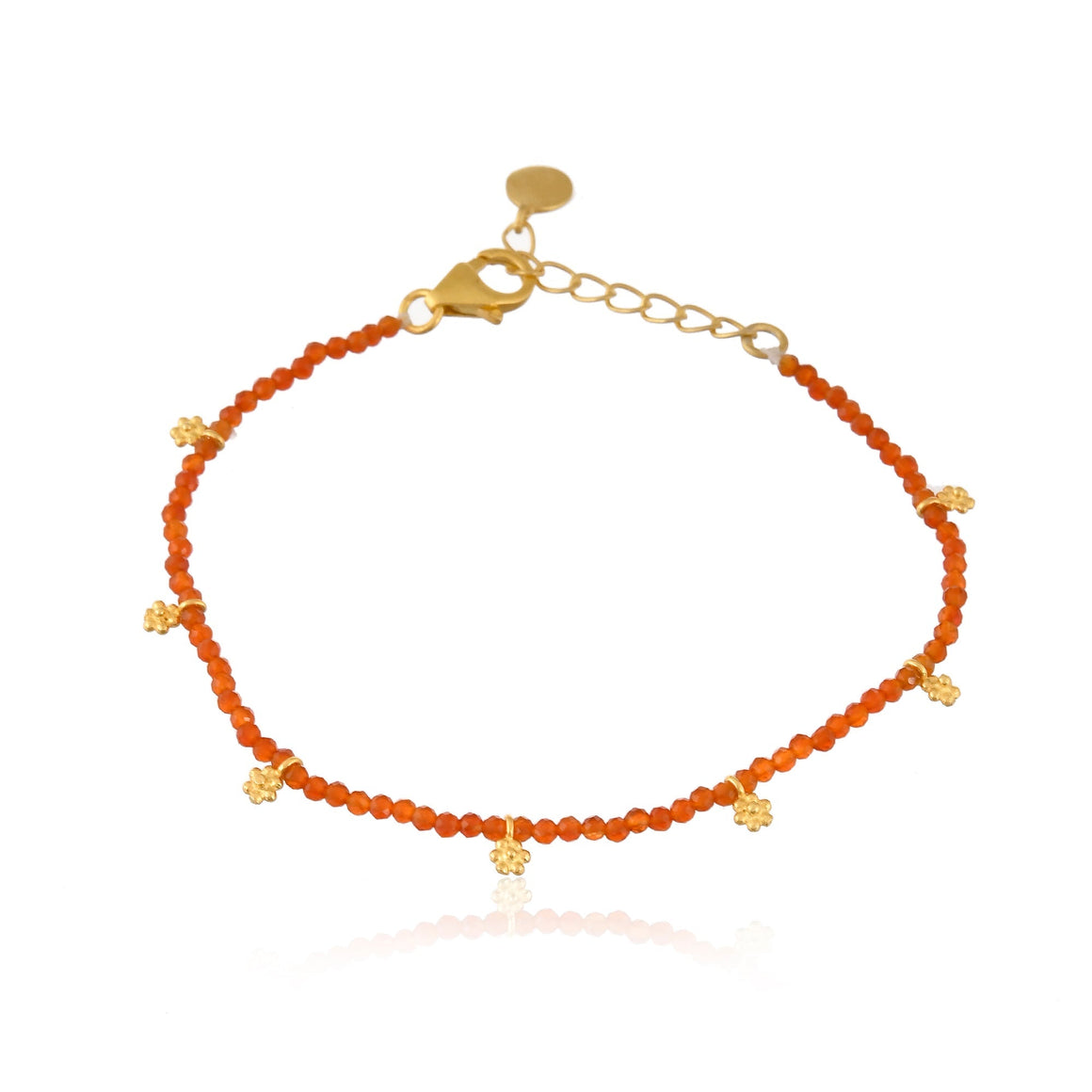 Red Onyx beads with gold charms.